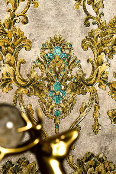 Close-up of ornate gold damask medallion with turquoise jewel centre and scrolling acanthus leaves