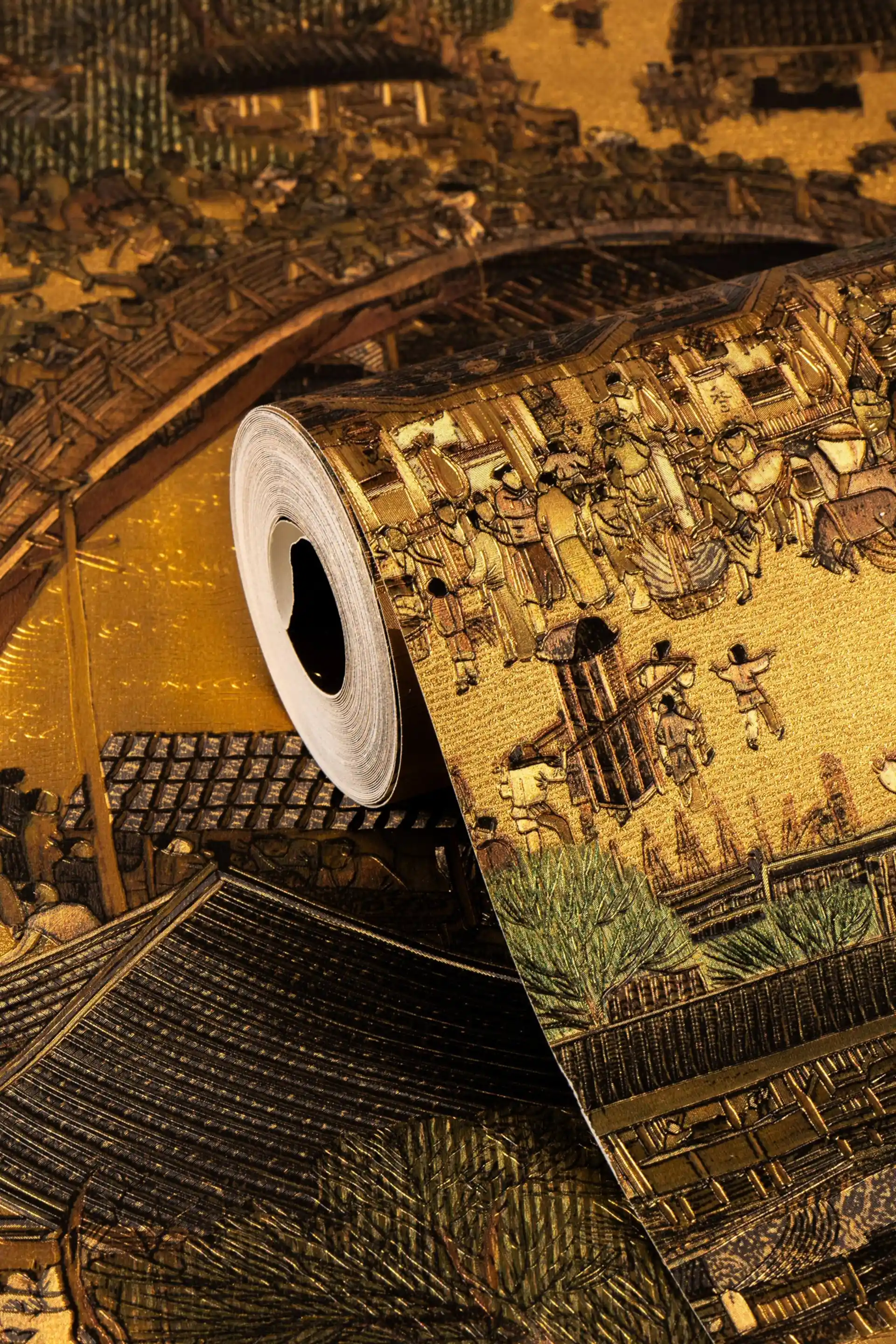 Rolled ancient golden village mural wallpaper showing detailed Chinese townscape with metallic gold finish