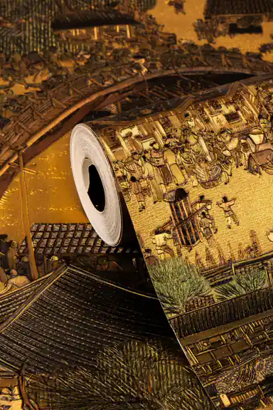 Rolled ancient golden village mural wallpaper showing detailed Chinese townscape with metallic gold finish