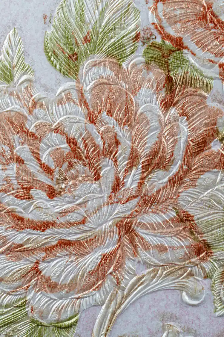 Extreme macro of deeply embossed pink and white rose petals with green leaf texture detail