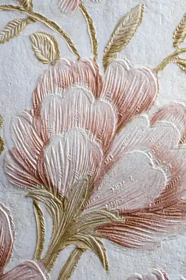 Extreme close-up of embossed pink rose petals with gold leaf stems on cream textured wallpaper surface