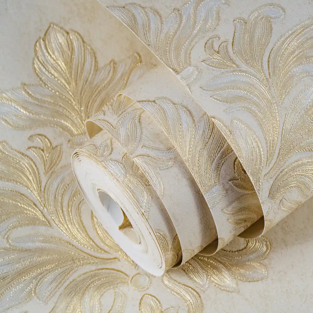 Rolled embossed cream and gold floral damask wallpaper showing large acanthus leaf scrollwork pattern