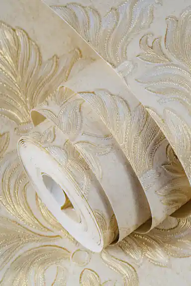 Rolled embossed cream and gold floral damask wallpaper showing large acanthus leaf scrollwork pattern