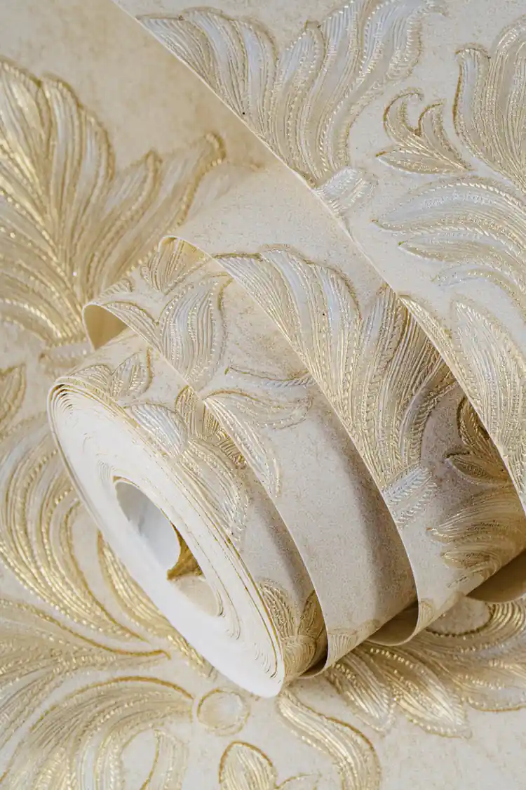 Rolled embossed cream and gold floral damask wallpaper showing large acanthus leaf scrollwork pattern