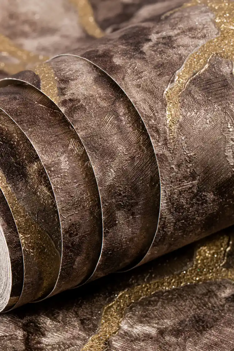 Rolled brown marble scroll wallpaper with vintage gold metallic vein accents on textured surface
