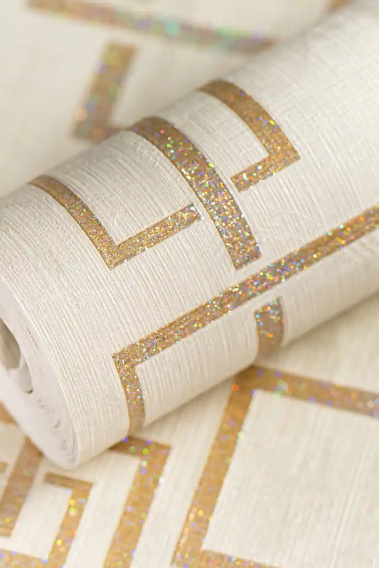 Golden glittery maze wallpaper roll with interlocking square pattern and holographic shimmer finish