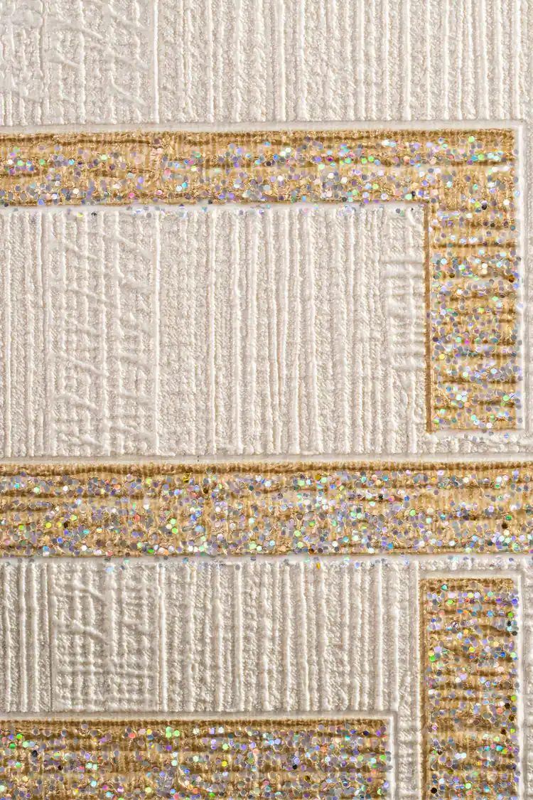 Extreme macro of textured white wallpaper with gold holographic glitter square borders