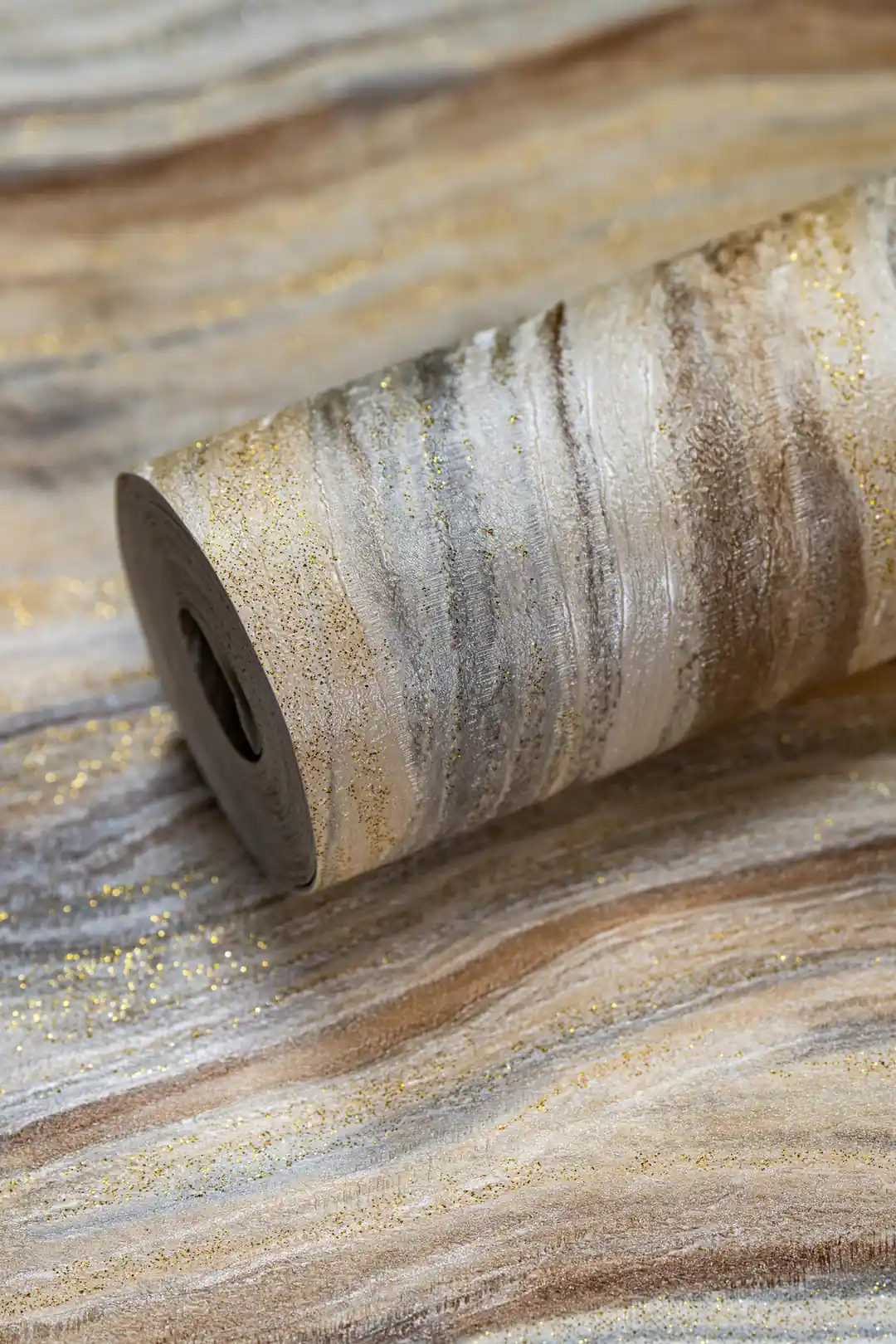 Luxe marble wave wallpaper roll with gold glitter veins in warm beige and silver tones