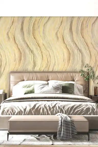 Gold wave marble wallpaper as bedroom accent wall behind leather bed with silk bedding and pillows