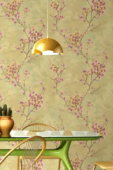 Blooming branch wallpaper in dining room with gold pendant lamp, green table and brass chair