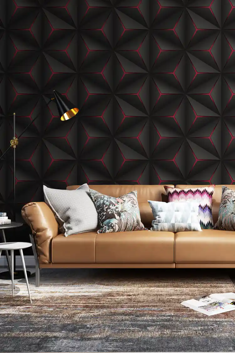 Modern living room with black 3D hexagonal wallpaper featuring red glow accents behind a tan leather sofa