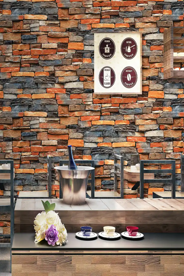 Cafe-style room scene with multicolor rustic brick wallpaper behind wooden tables and vintage coffee poster