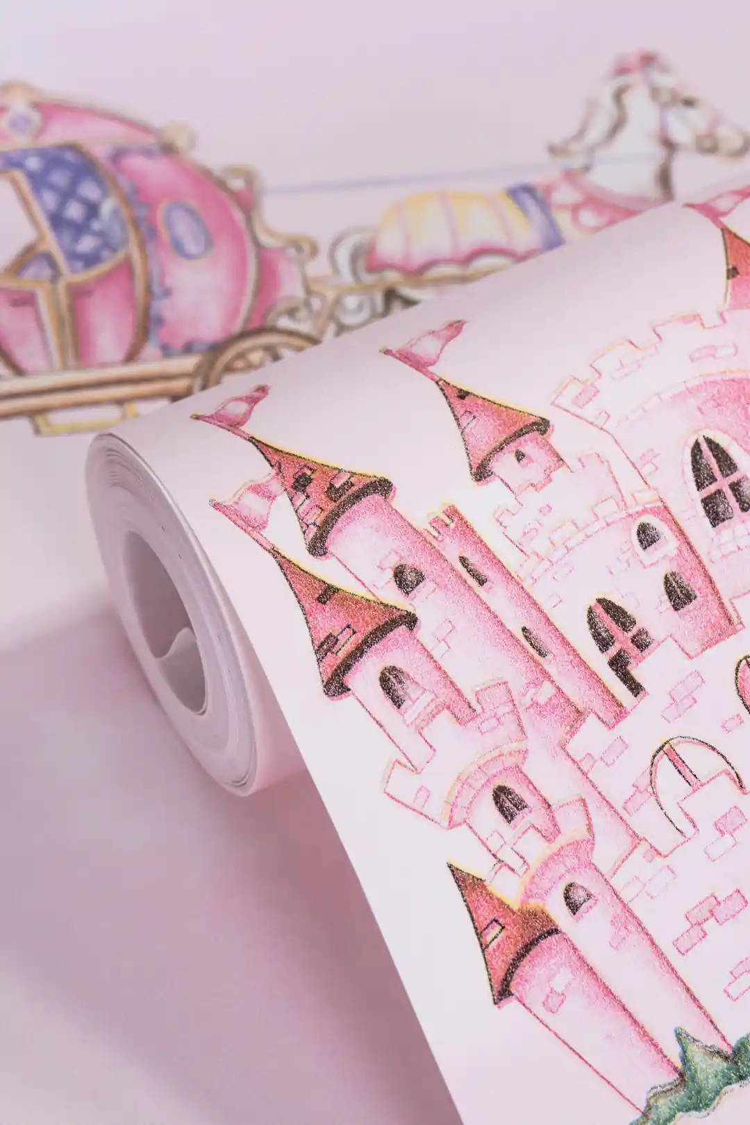 Pink princess castle wallpaper roll showing illustrated castles, horse-drawn carriage, and rainbow motifs