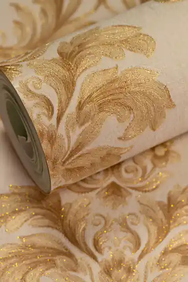 Premium gold floral leaf damask wallpaper roll with heavy embossed glitter on a cream background