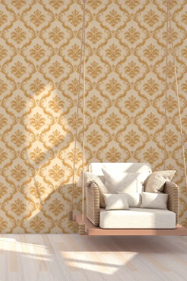 Elegant room scene with gold damask wallpaper behind a hanging swing chair on light wooden flooring