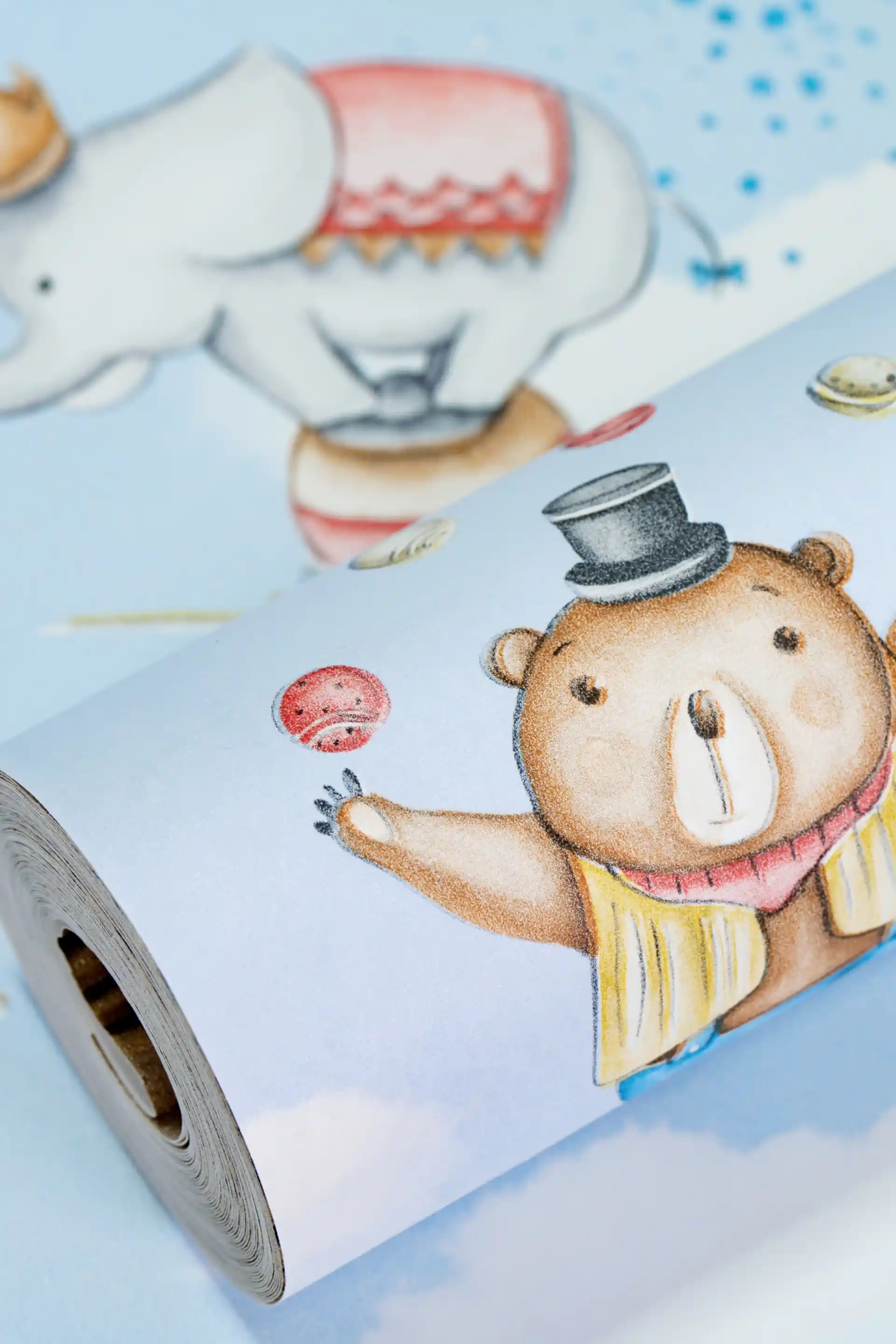 Blue circus animals wallpaper roll with illustrated bear in top hat and elephant on a sky blue background