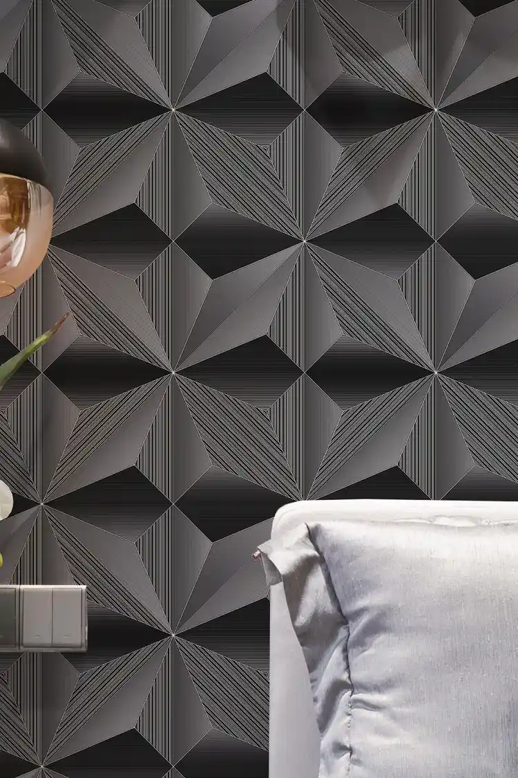 Close-up of the installed black geometric fan pattern wallpaper with copper pendant lamp and sofa edge