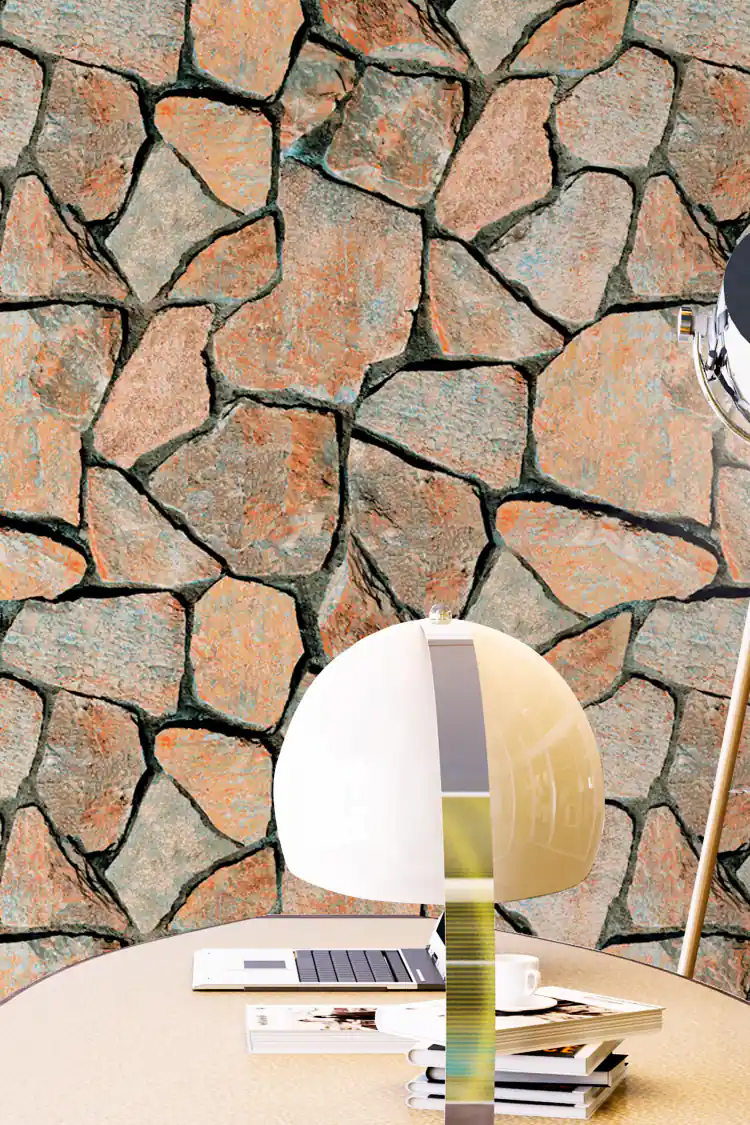 Rustic multicolor stone wall wallpaper installed in a study with a desk lamp and round table