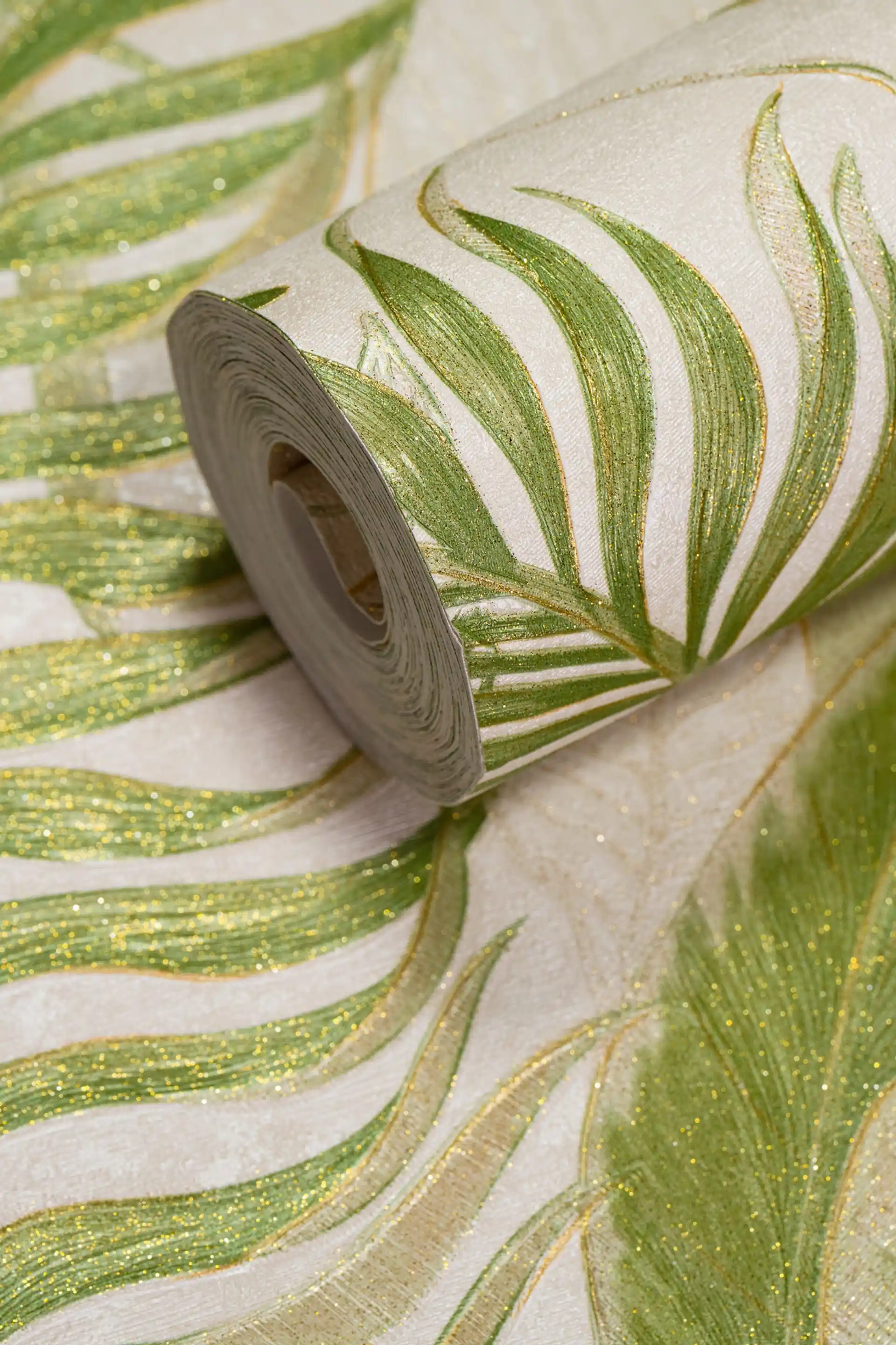 Full roll of green tropical palm leaf wallpaper with gold glitter outlines on an off-white background