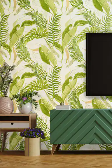 Living room scene with lush green palm frond wallpaper behind a teal media console and flower vases