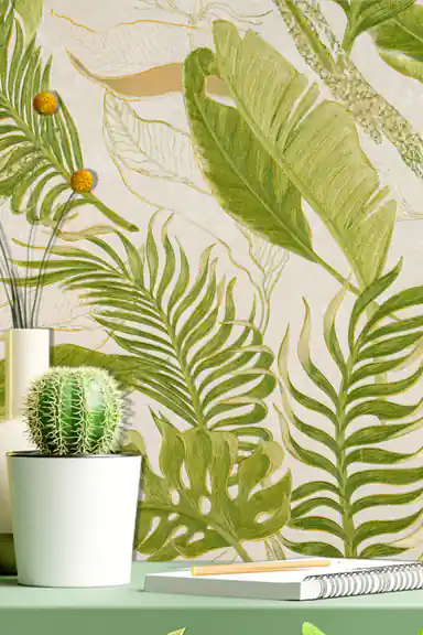 Close-up of tropical banana and monstera leaf pattern wallpaper with cactus and notebook on green shelf