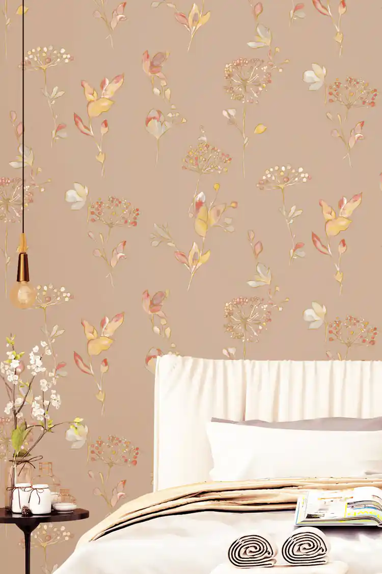 Bedroom corner with warm-toned botanical leaf wallpaper, pendant light, and white bedding