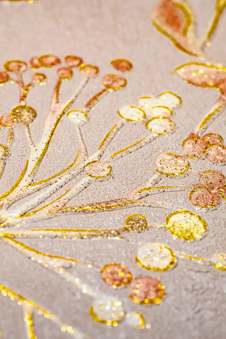 Macro close-up of gold glitter berry clusters and leaf details on warm tan botanical wallpaper