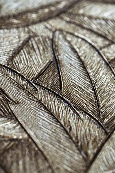 Extreme macro of overlapping bronze metallic leaf textures showing fine shimmer detail and veining