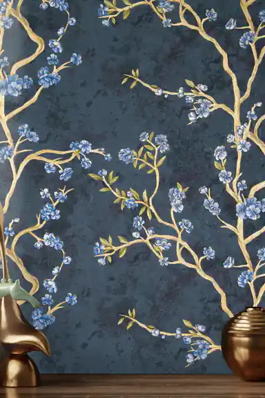 Installed wall close-up of teal floral wallpaper with gold branch details and bronze decorative vases
