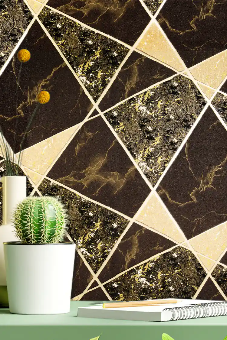 Desk vignette with cactus plant and notebook against black and gold marble triangle wallpaper