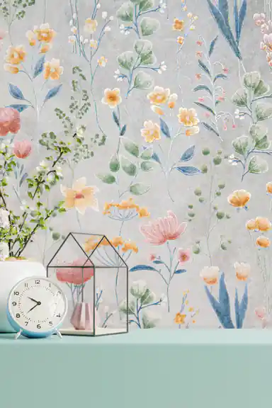 Installed wall of colorful wildflower wallpaper with a clock, glass terrarium, and mint-green shelf
