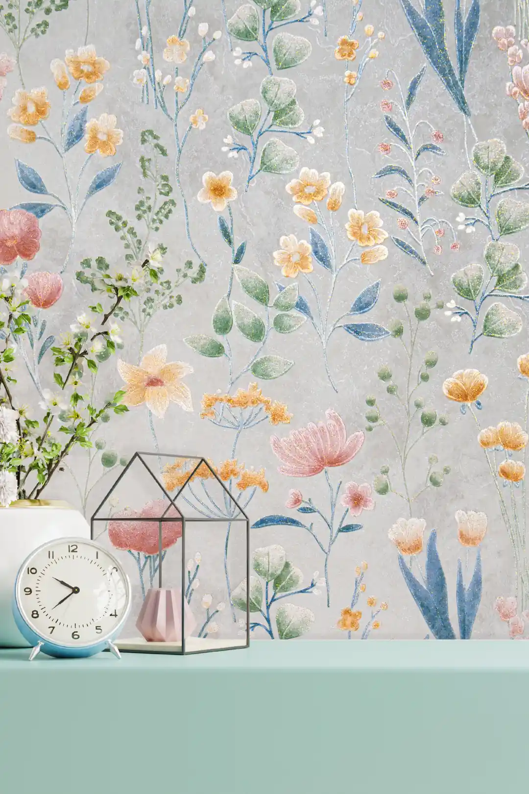 Installed wall of colorful wildflower wallpaper with a clock, glass terrarium, and mint-green shelf