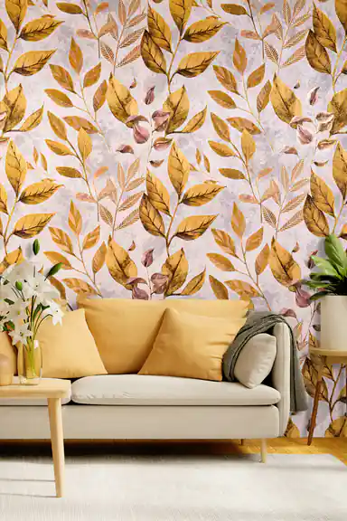 Golden autumn leaves botanical wallpaper in a living room with a mustard sofa and white lily arrangement