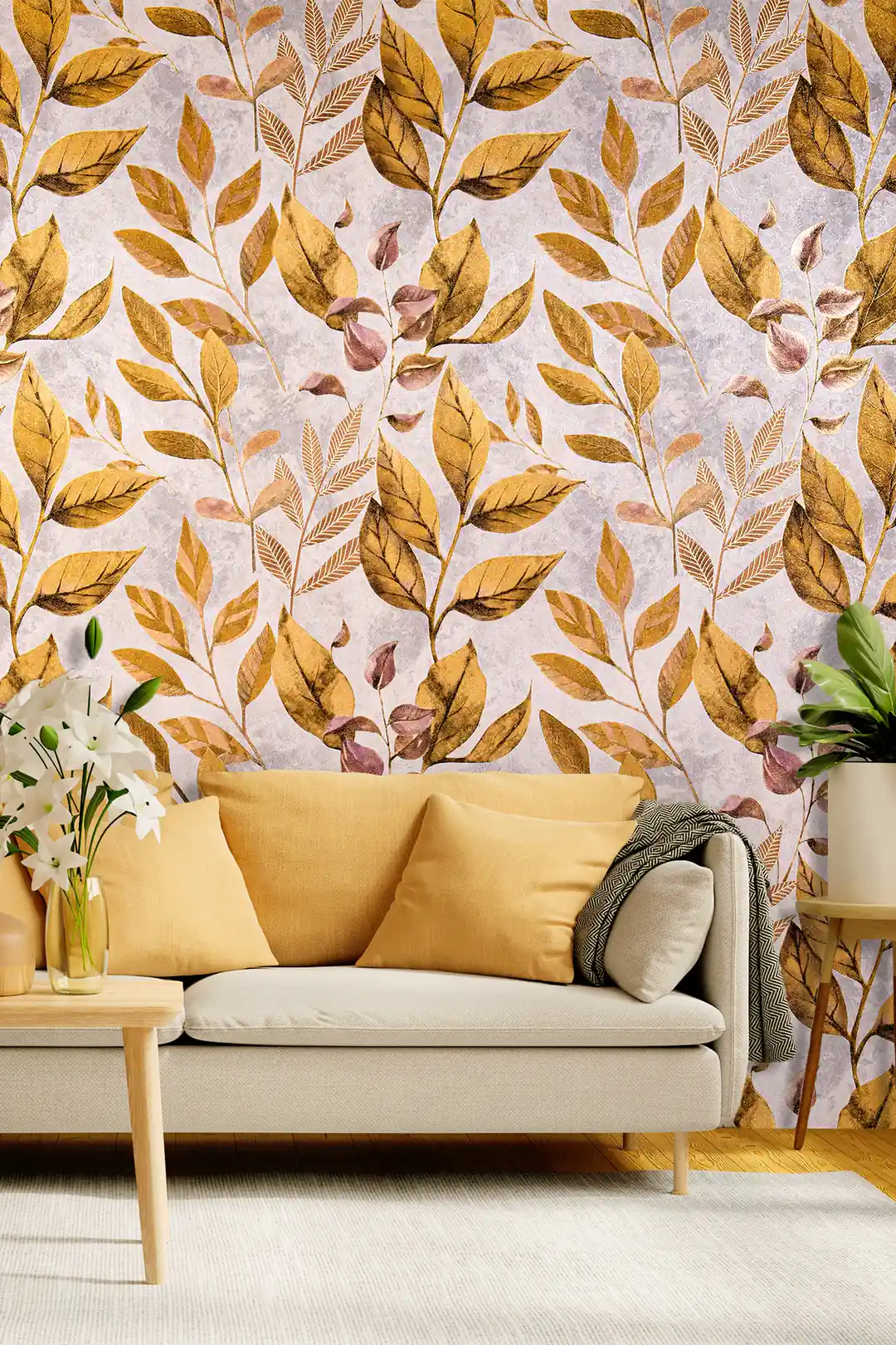Golden autumn leaves botanical wallpaper in a living room with a mustard sofa and white lily arrangement
