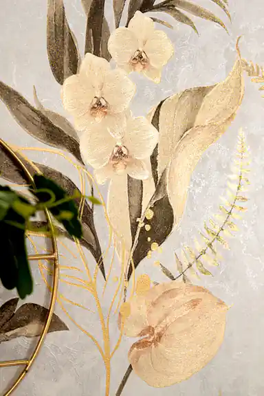 Detailed view of cream orchid blooms and copper-edged ferns with gold leaf accents on light wallpaper