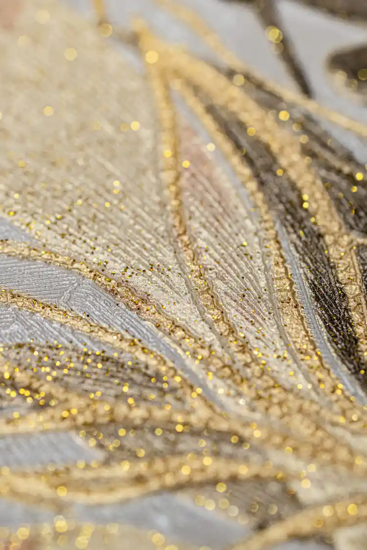 Extreme close-up of copper and gold glitter details on tropical leaf and orchid wallpaper texture