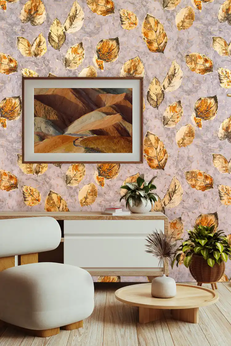 Autumn brown fallen leaves wallpaper in a modern living room with rounded white furniture and framed landscape art