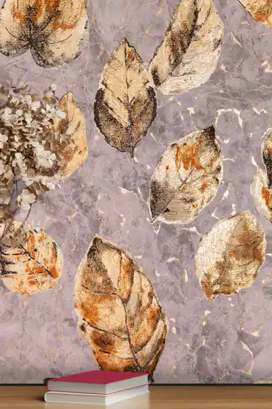 Close-up of scattered brown and gold glitter leaves on purple-grey textured wallpaper with dried hydrangea