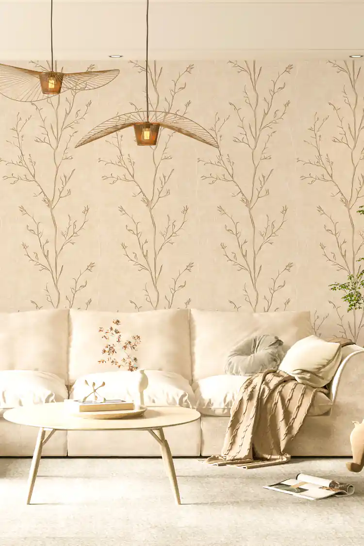 Delicate tree branches wallpaper in a serene living room with a beige sofa and woven pendant lights