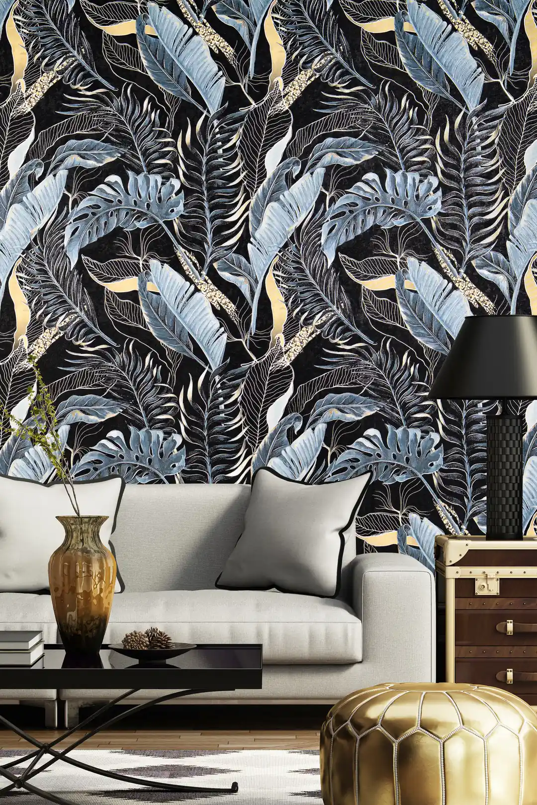 Dark tropical jungle wallpaper in a luxurious living room with a grey sofa and gold leather pouf