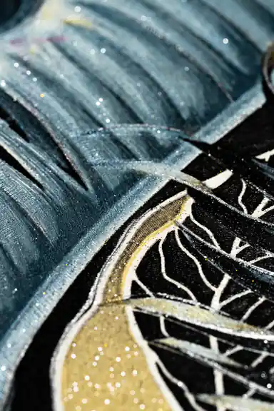 Extreme macro of glitter texture on dark blue banana leaf with gold detailing on black wallpaper surface