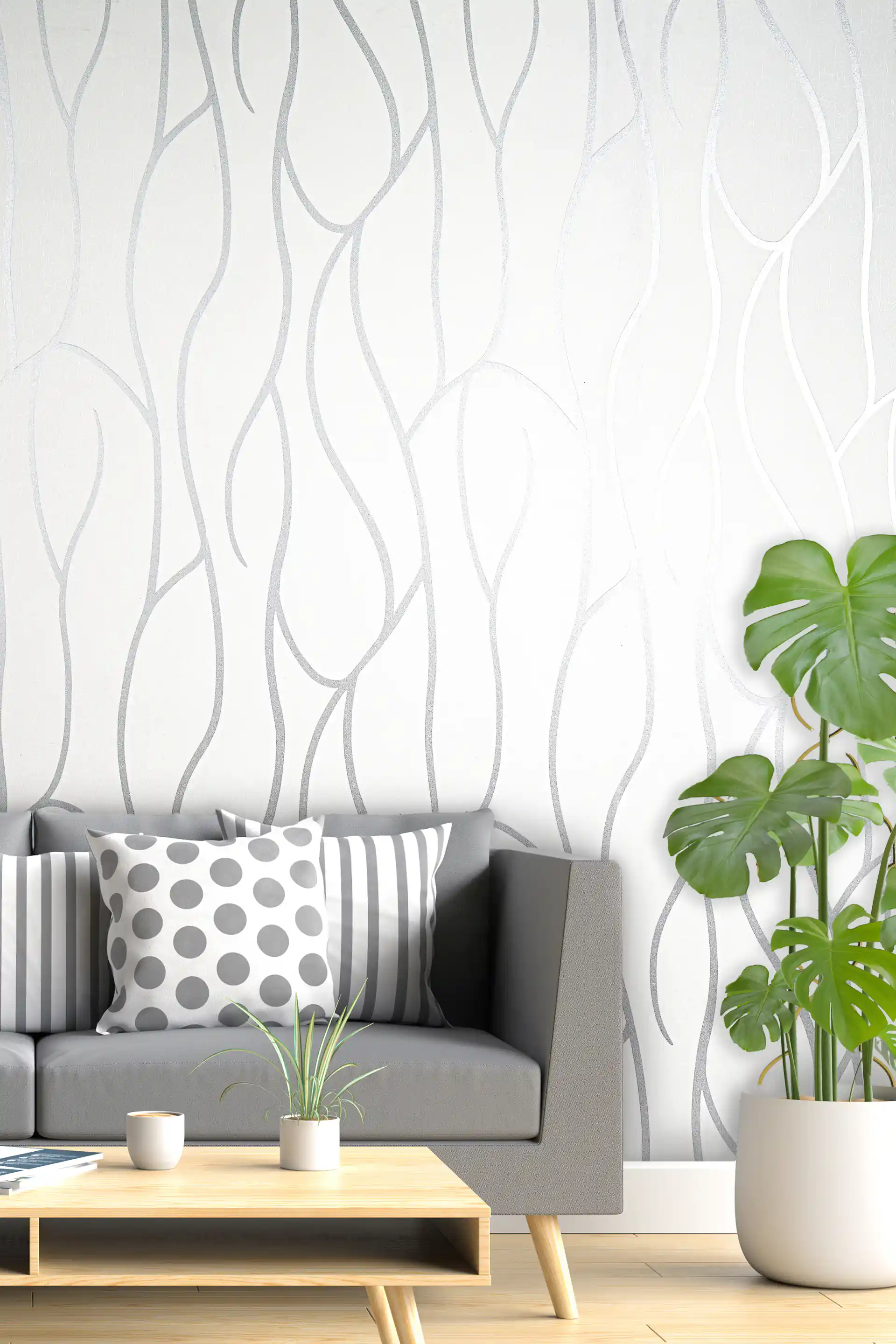 White wallpaper with flowing silver swirl lines installed in a modern living room with a grey sofa