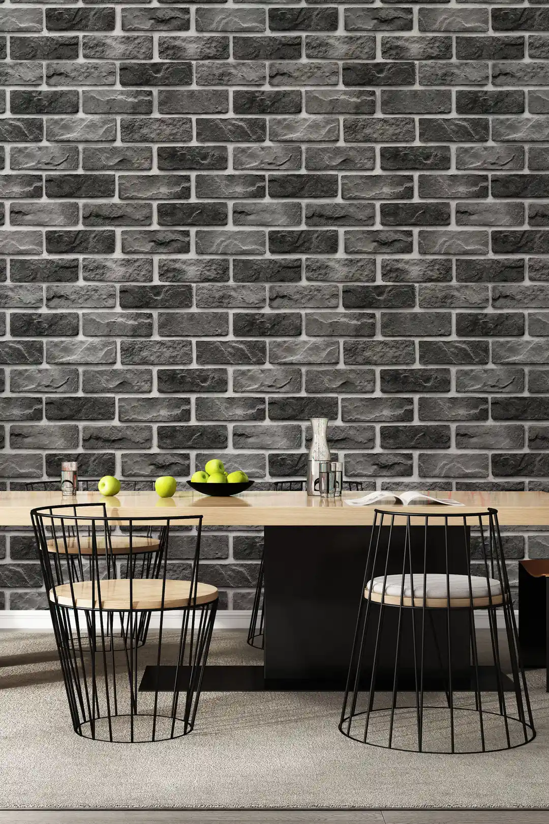 Charcoal grey stone brick wallpaper installed in a dining room with a modern table and wire-frame chairs