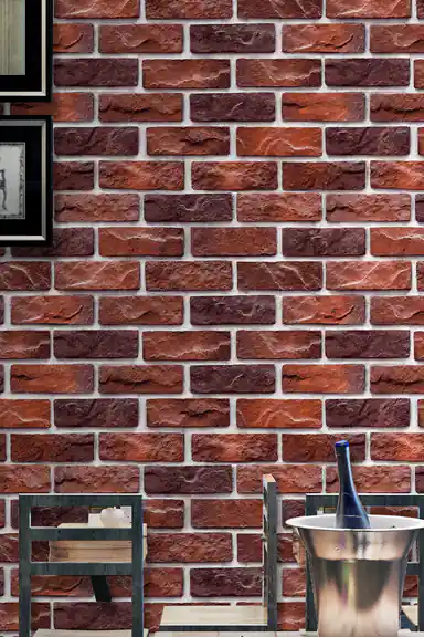 Rustic red brick wallpaper close-up in a bar area with framed artwork and wine bottle ice bucket