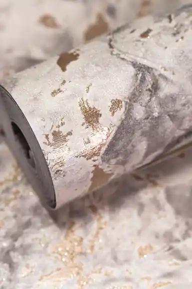Rolled grey marble wallpaper with scattered gold foil flecks and accents on a natural stone texture base