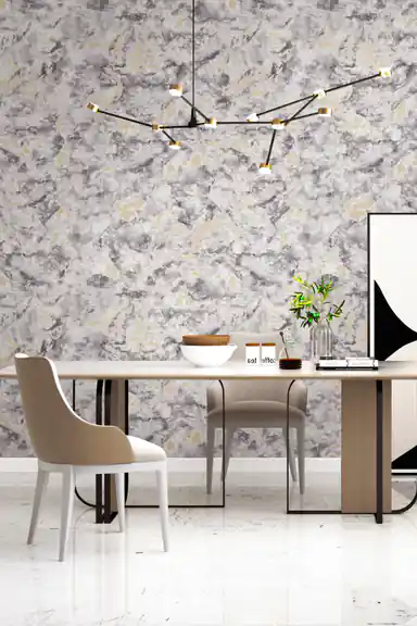 Grey marble wallpaper with gold accents in a modern dining room with chandelier and beige upholstered chairs