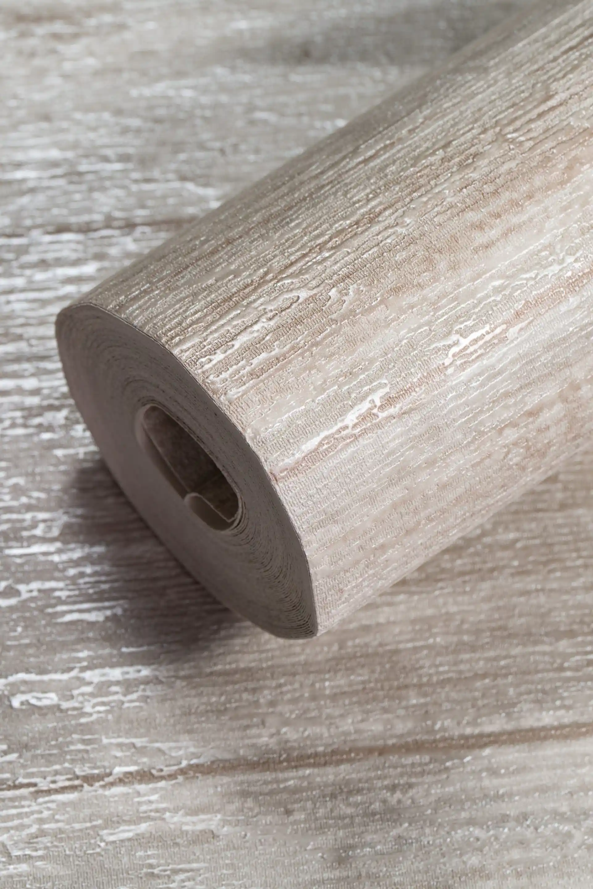 Rolled beige textured wallpaper with subtle distressed cream and tan finish