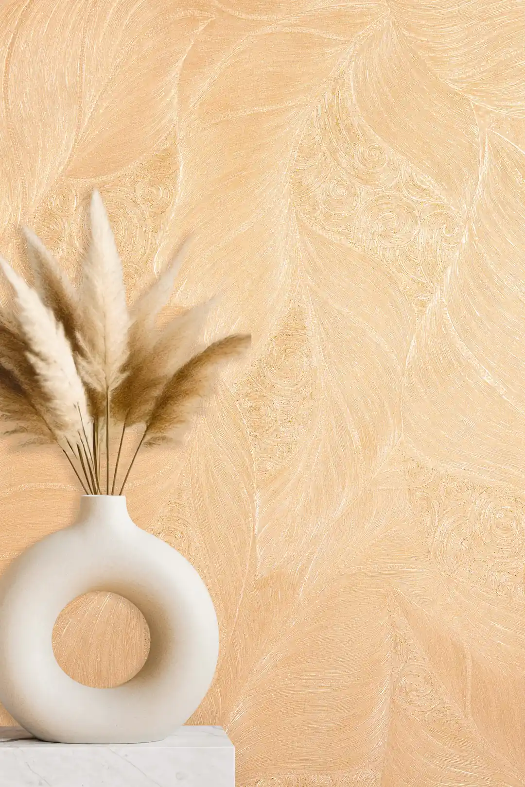 Close-up of embossed leaf and swirl wallpaper with a pampas grass arrangement in a ring-shaped vase