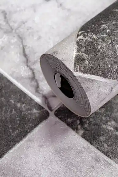 Rolled black and white marble checker wallpaper showing diamond tile pattern with realistic stone texture