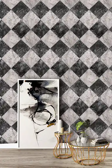 Black and white marble checker wallpaper in a room with abstract art, a gold wire table, and green plant